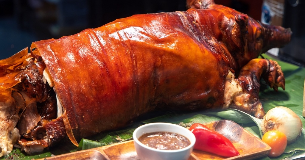 lechon baboy the bailiwick academy Pinoy Christmas Party Food Ideas