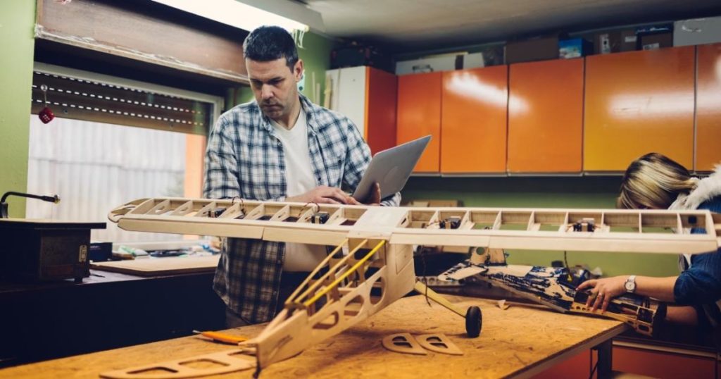 the bailiwick academy man making a model plane